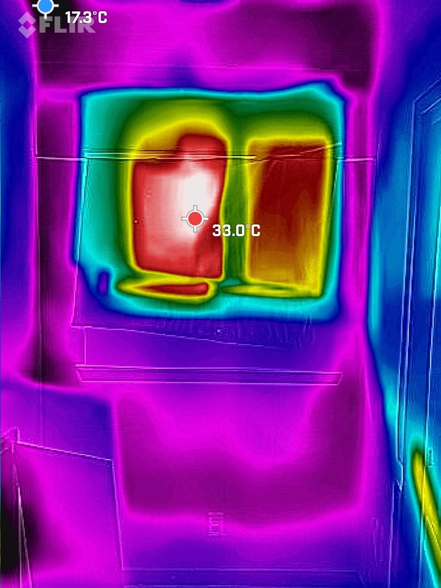 Thermal image of a wall showing heat patterns, taken during one of our inspections